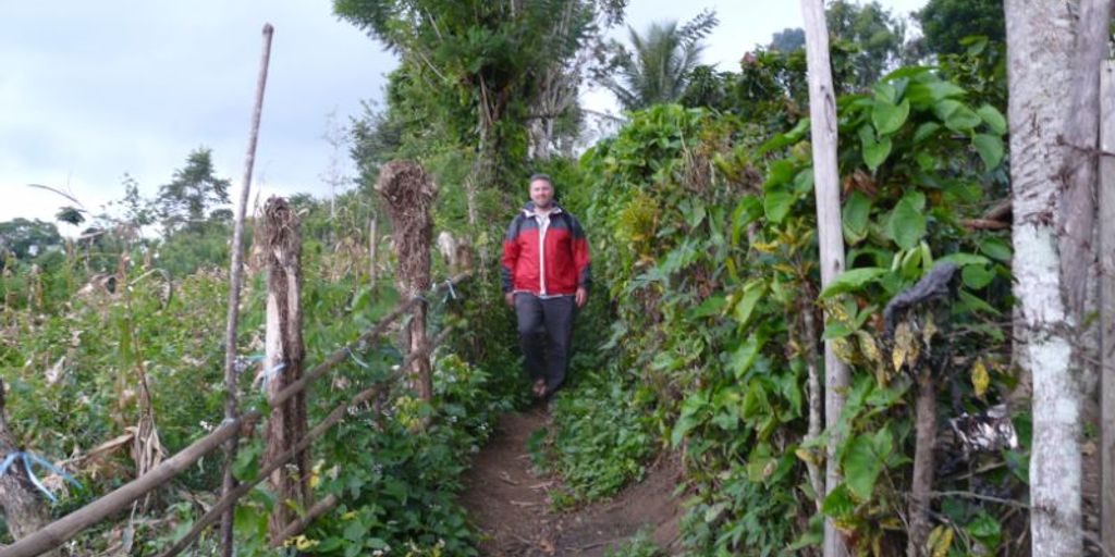 Sumatra landscape with slim woman drinking herbal tonic