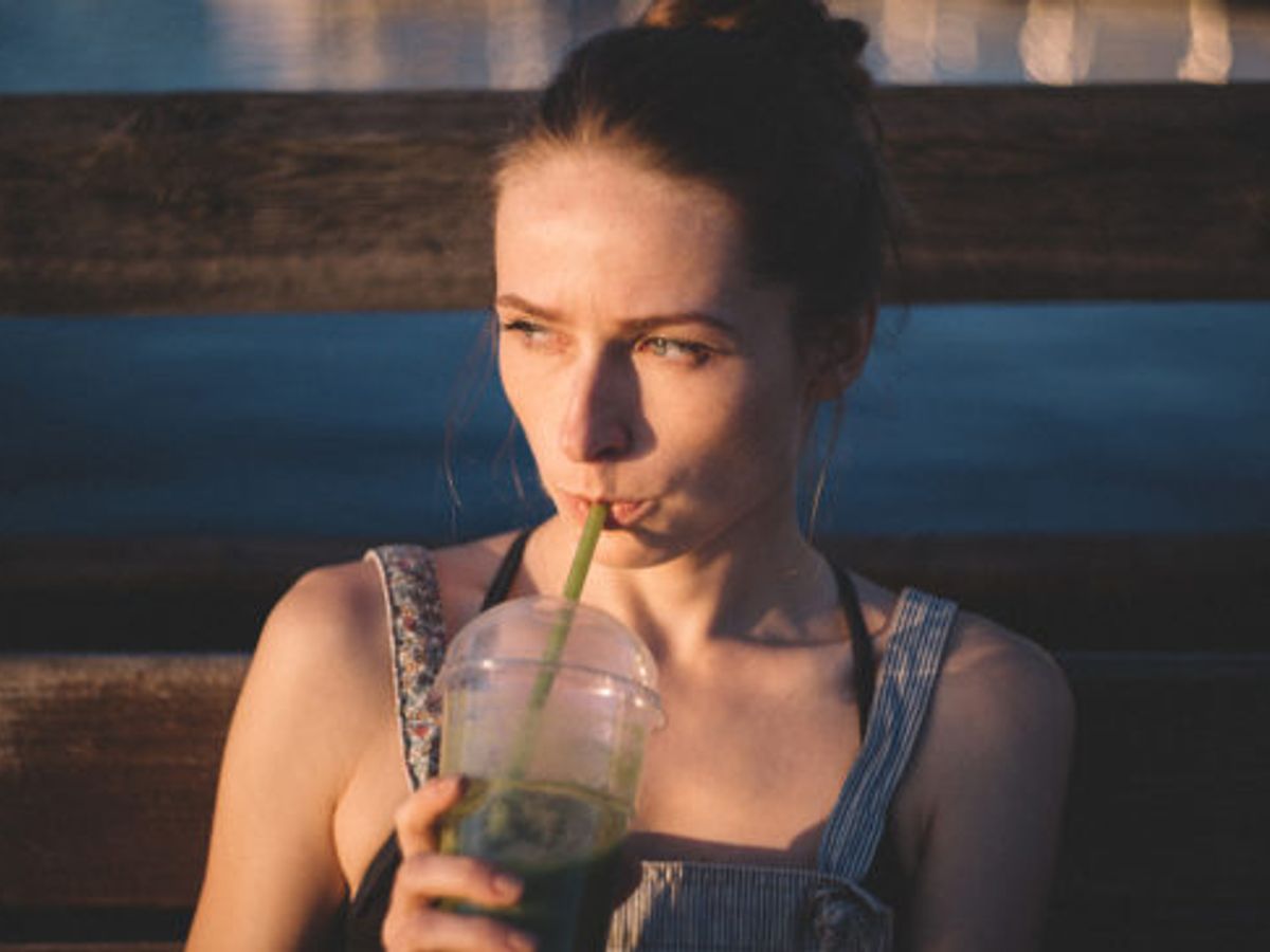 person drinking water with weight loss elements