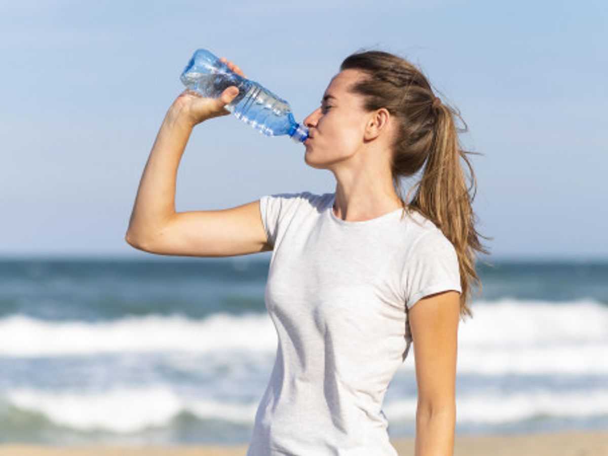 person drinking water before meal for weight loss