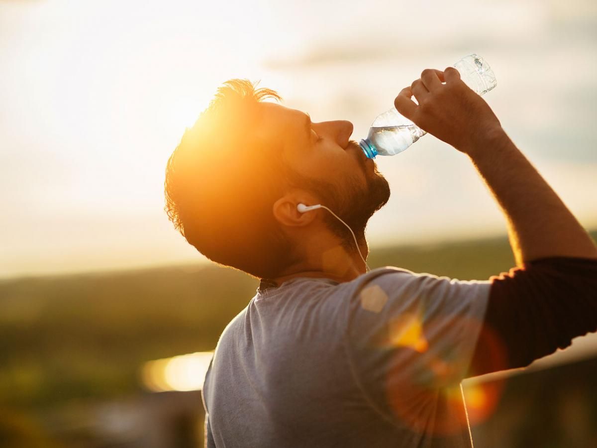 healthy woman drinking water with weight loss icons