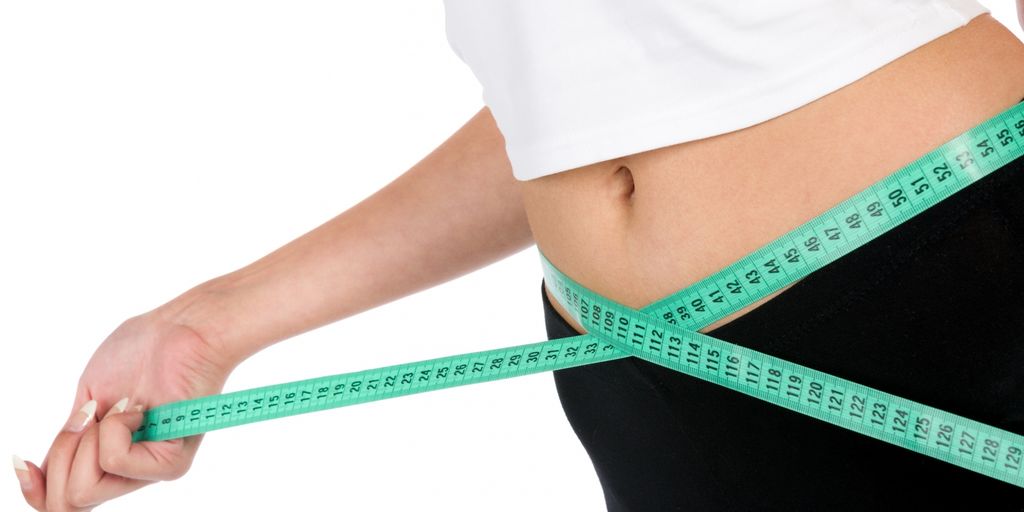 woman measuring waist fitness healthy lifestyle