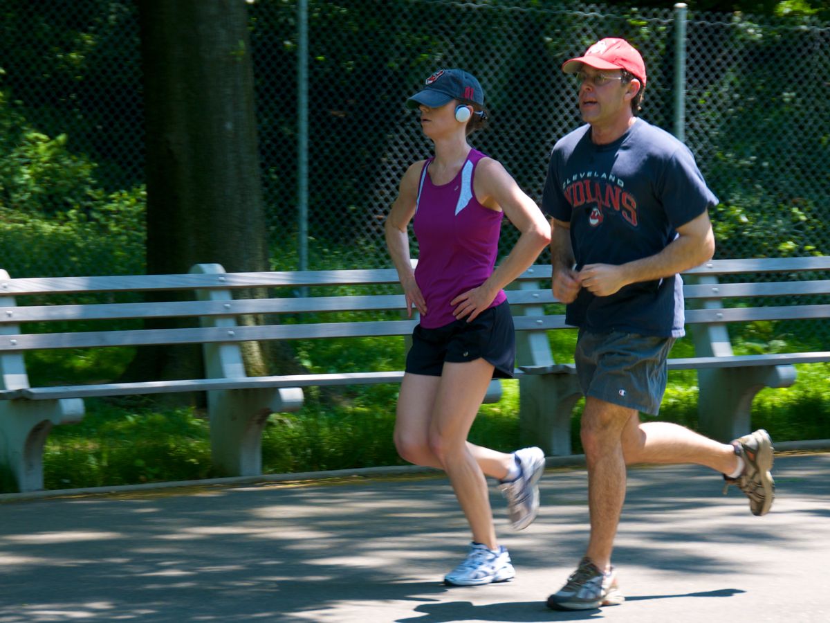 woman jogging in a park, healthy lifestyle, weight loss journey, long-term fitness